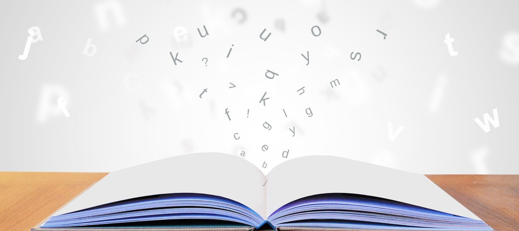 QuietFrames en livsinvestering! Bilden visar en öppen bok med bokstäver som flödar ut